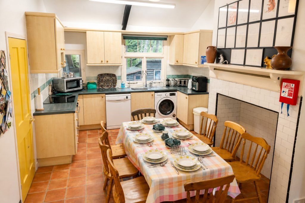 Large fully equipped kitchen with dining table at Windy Gap