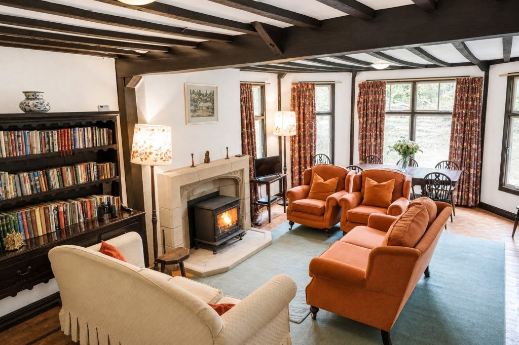 Large living room with woodburner at Windy Gap